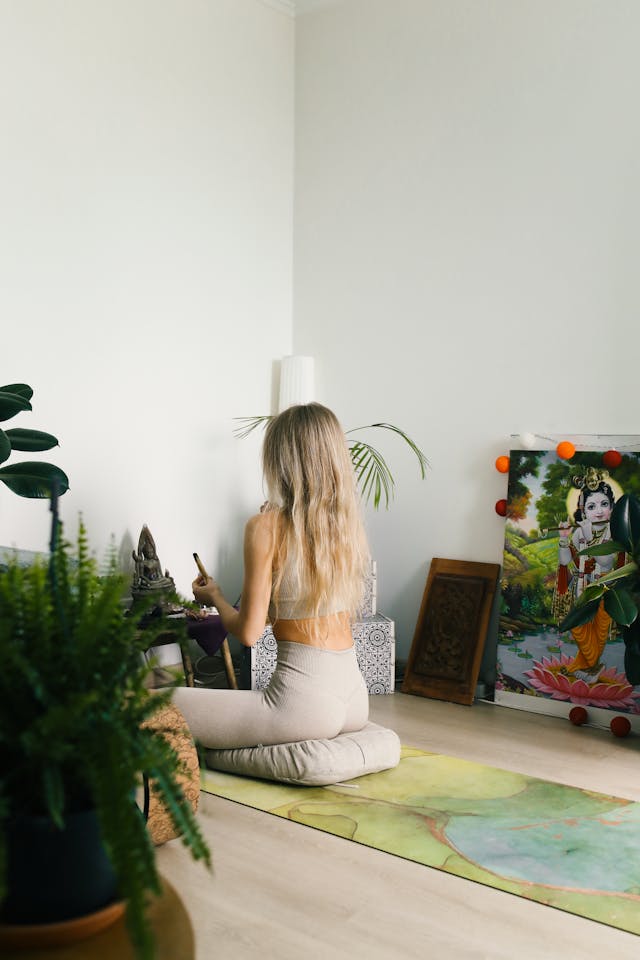 Person meditating with props